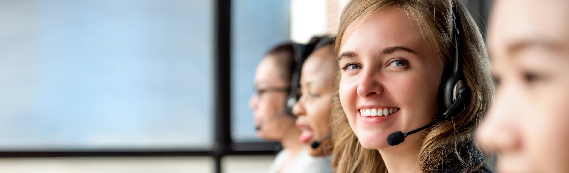 Call center woman smiling at the camera